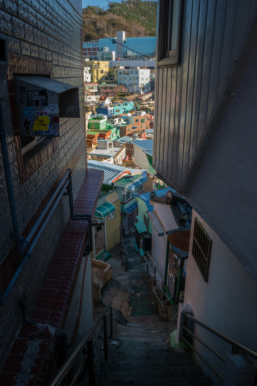 a narrow alley way with a bunch of buildings in the background