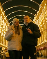 A professional advisor explaining insurance options to a young couple.