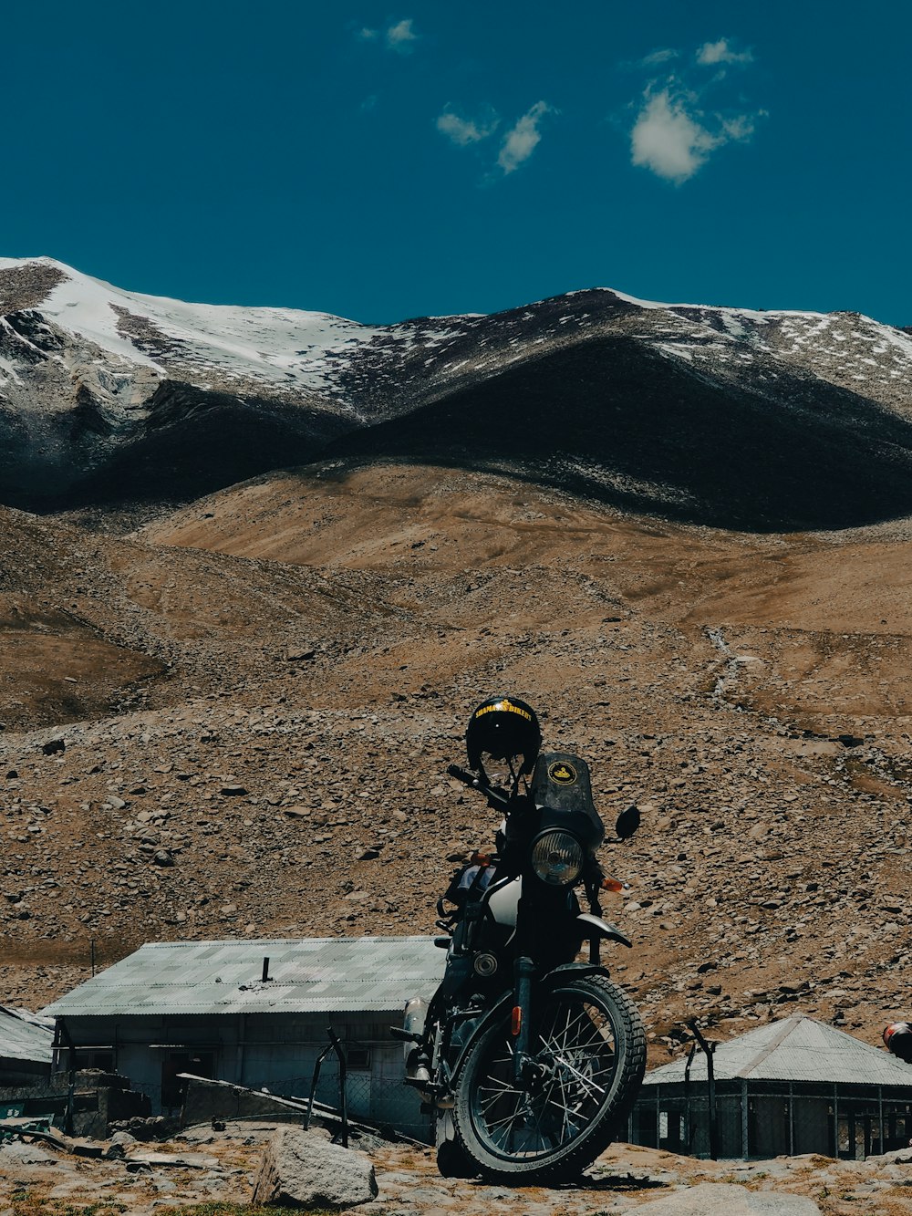 a person on a motorcycle in the mountains