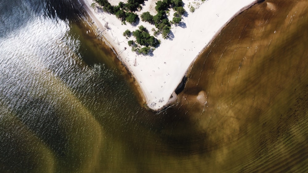 an aerial view of a small island in the middle of a lake