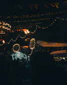 Festive event night at Portalburgers with string lights and customers savoring their meals