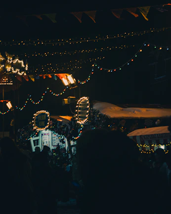 Festive event night at Portalburgers with string lights and customers savoring their meals