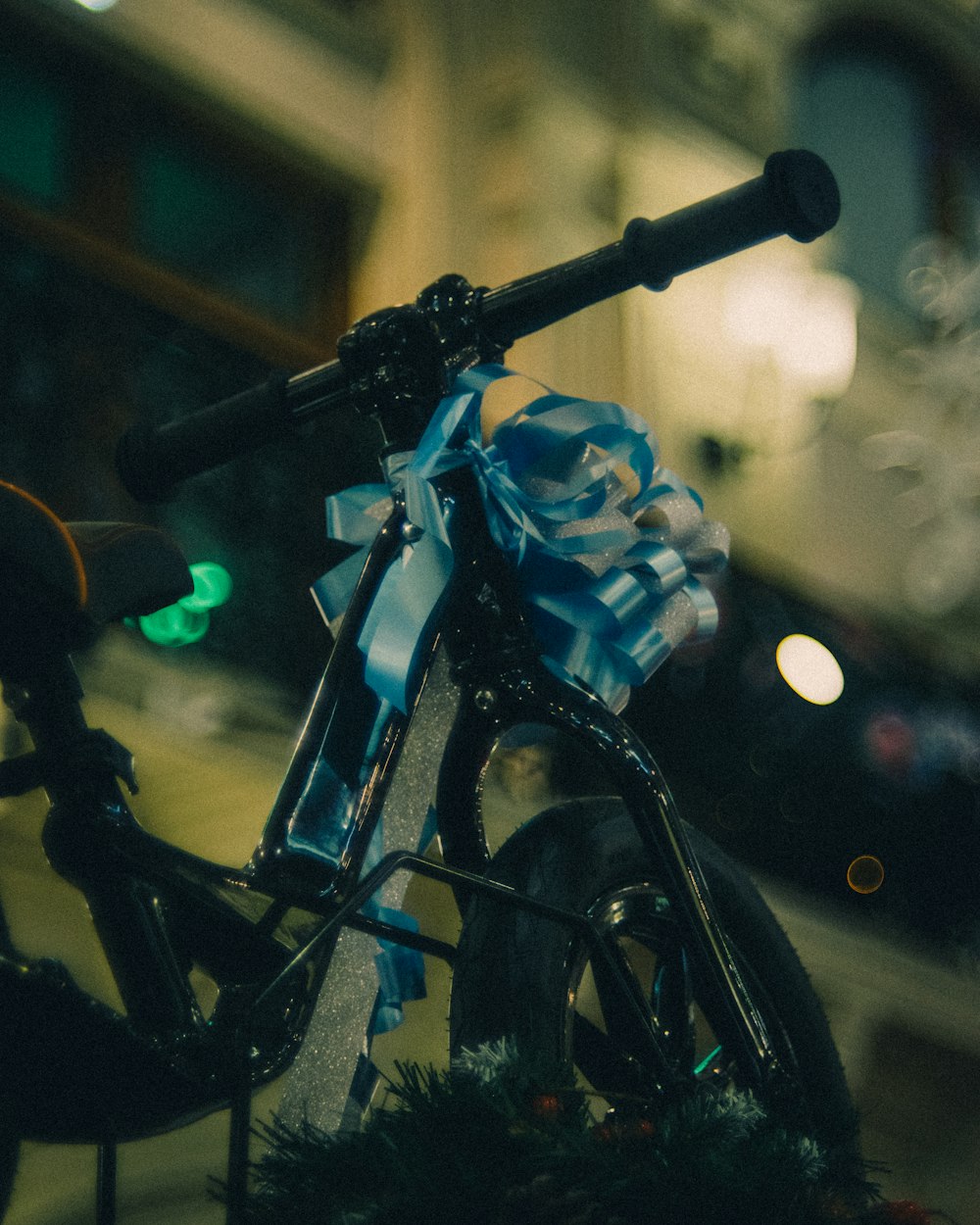 a close up of a bicycle with a blue bow