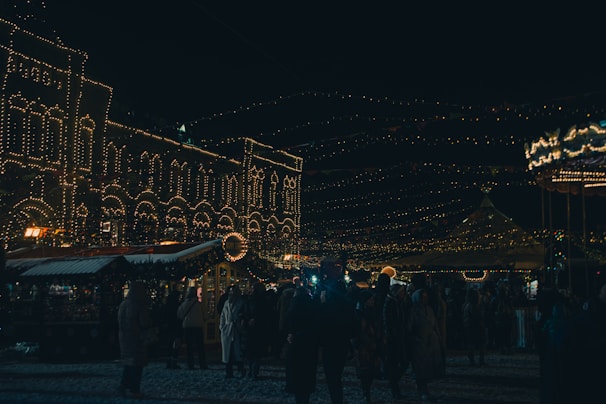 Evening scene with twinkling lights and happy faces enjoying the festival atmosphere