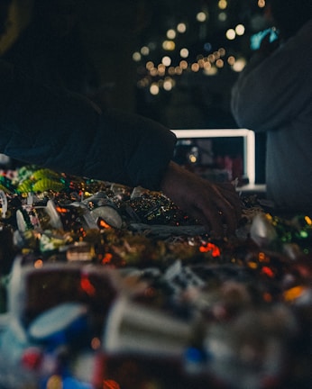 a person reaching for a bag of confetti on a table