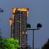 Evening shot of a completed building project illuminated, highlighting safety installations.