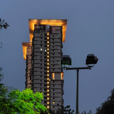 Evening shot of a completed building project illuminated, highlighting safety installations.