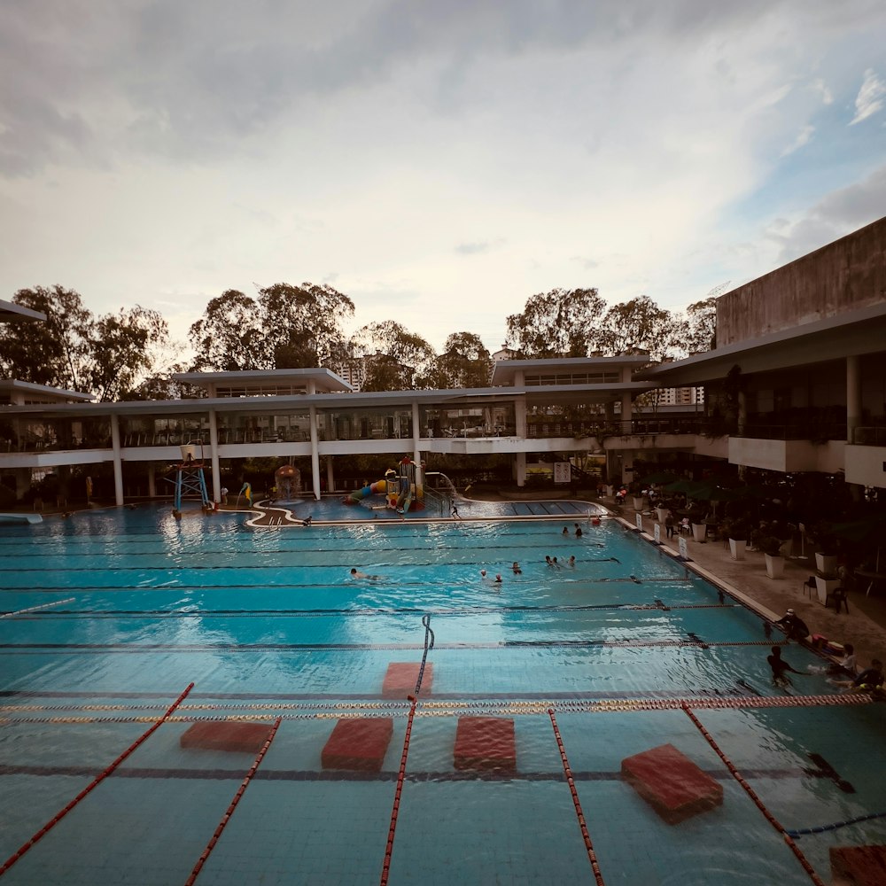 a large swimming pool with people in it