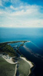 an aerial view of an island in the middle of the ocean