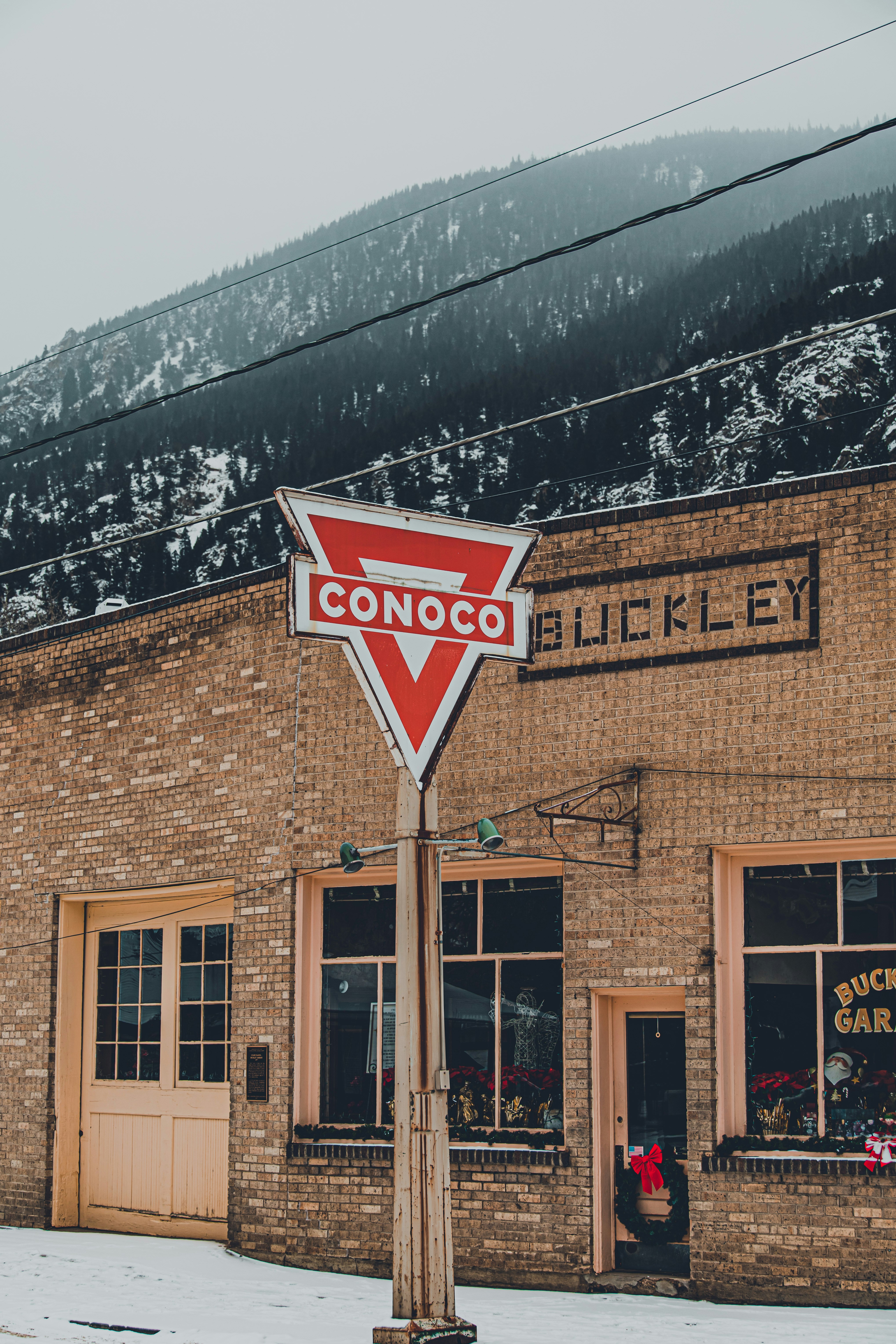 a street sign in front of a brick building