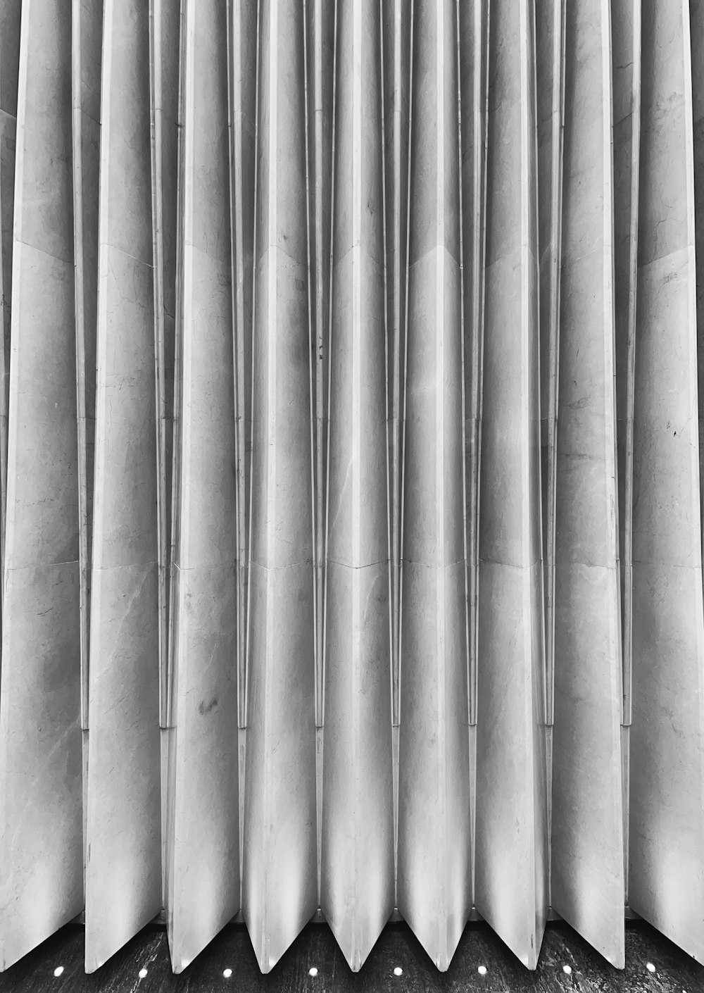 a black and white photo of a curtain