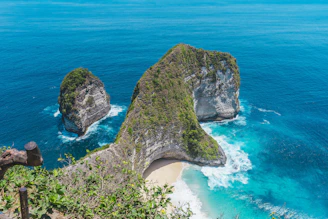 two large rocks sticking out of the ocean