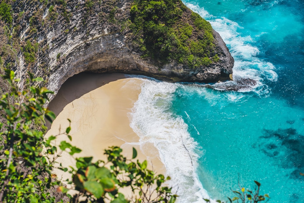 an aerial view of a beach and a cliff