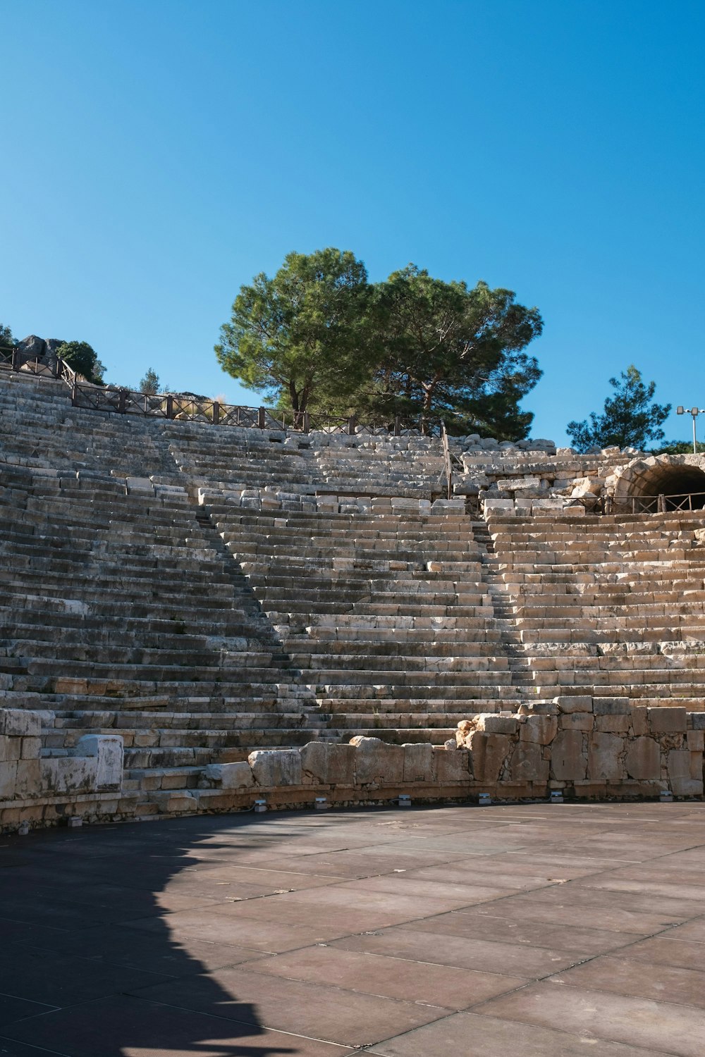 a large stone structure with a tree in the middle of it