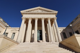 a large building with columns and a door