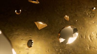 Numerous floating or levitating diamonds, cut in various shapes, with a glimmering, reflective quality. The background has a textured, gold-hued appearance.