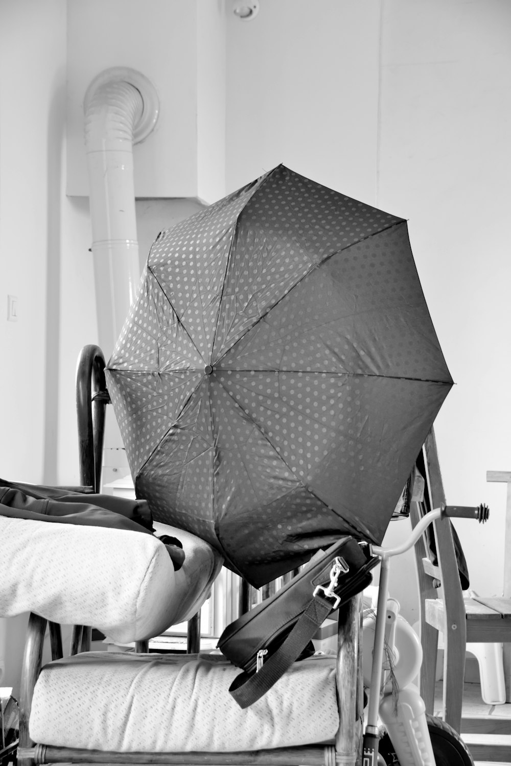 a chair with an umbrella on top of it