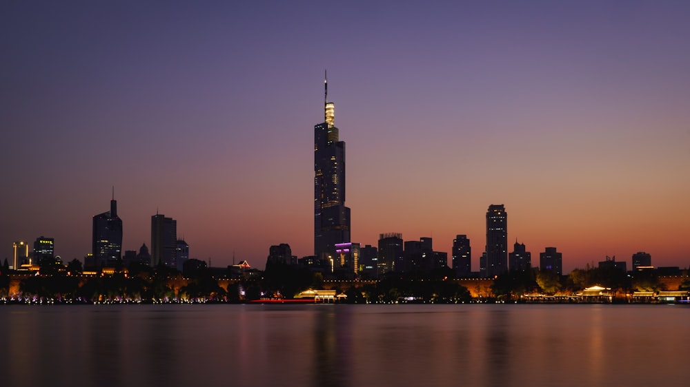 a view of a city skyline at dusk