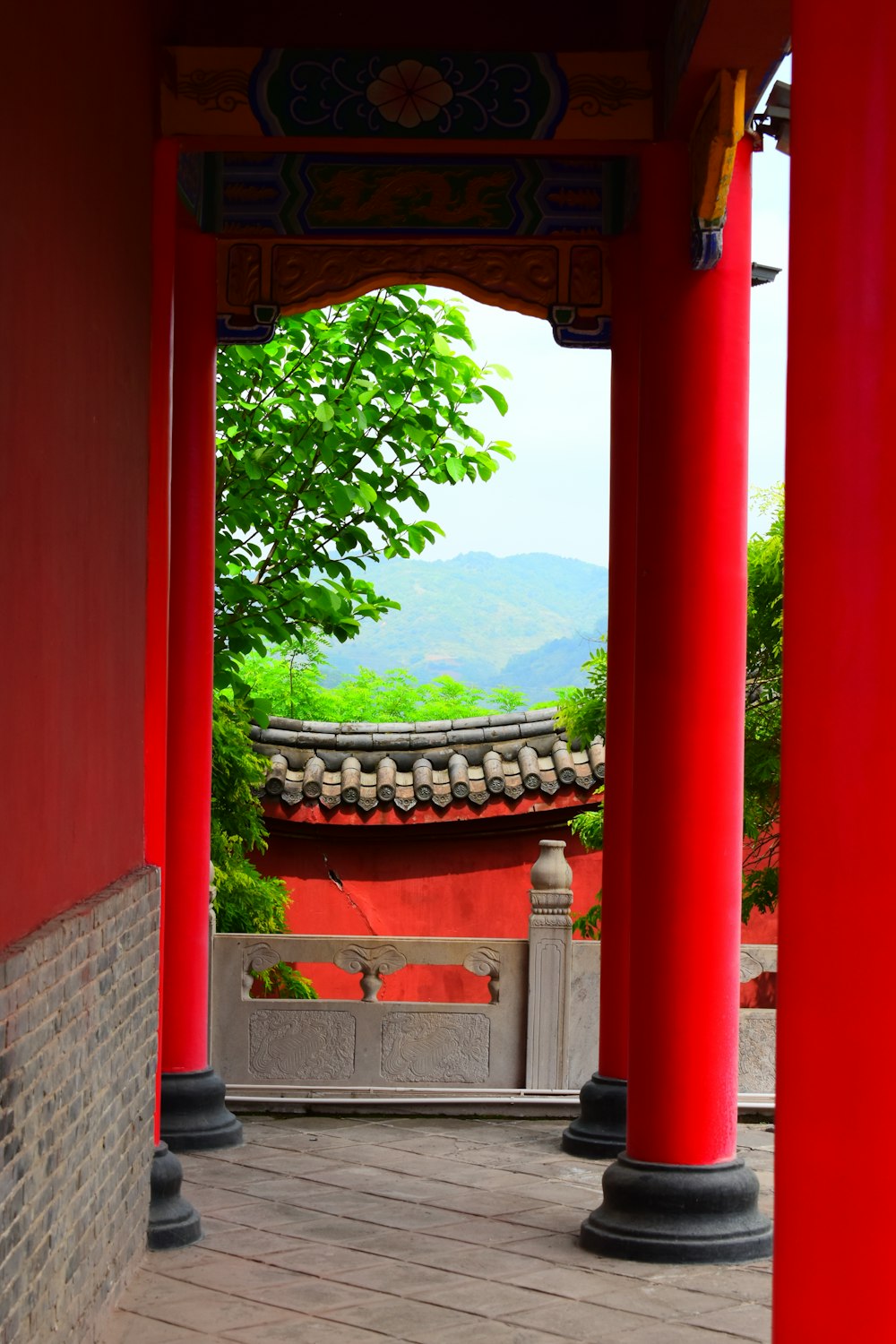 a red building with columns in front of it