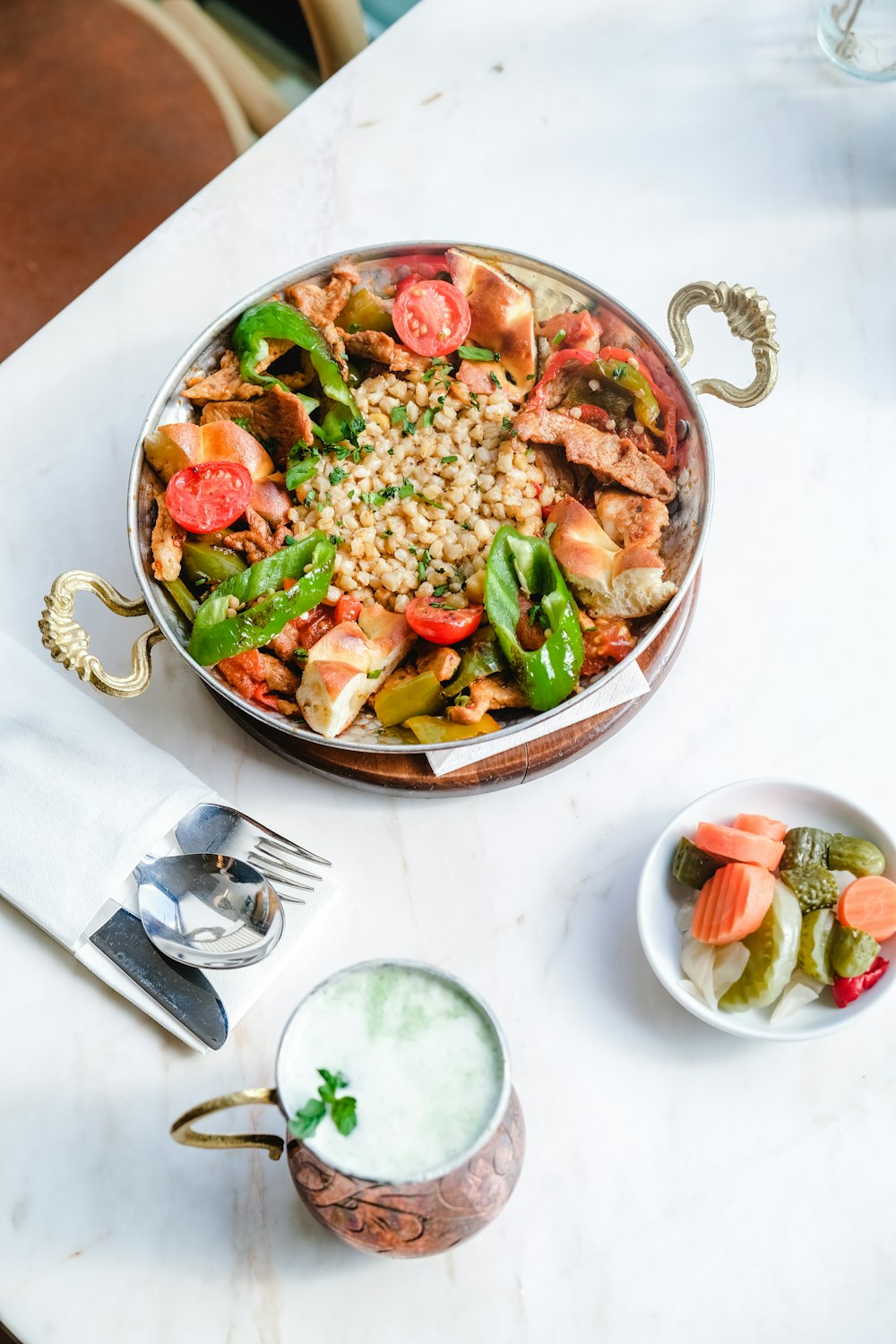 a bowl of food on a white table