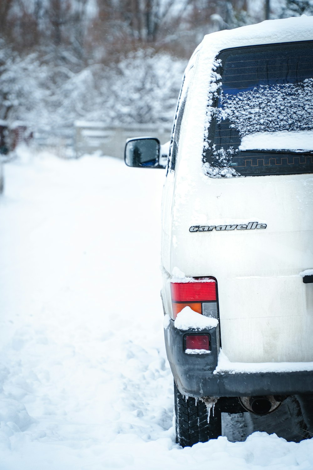 a white van parked on a snowy street