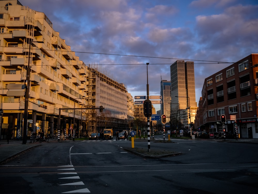 a city street with tall buildings and a traffic light