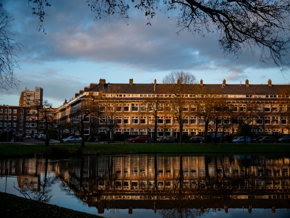 a large building sitting next to a body of water