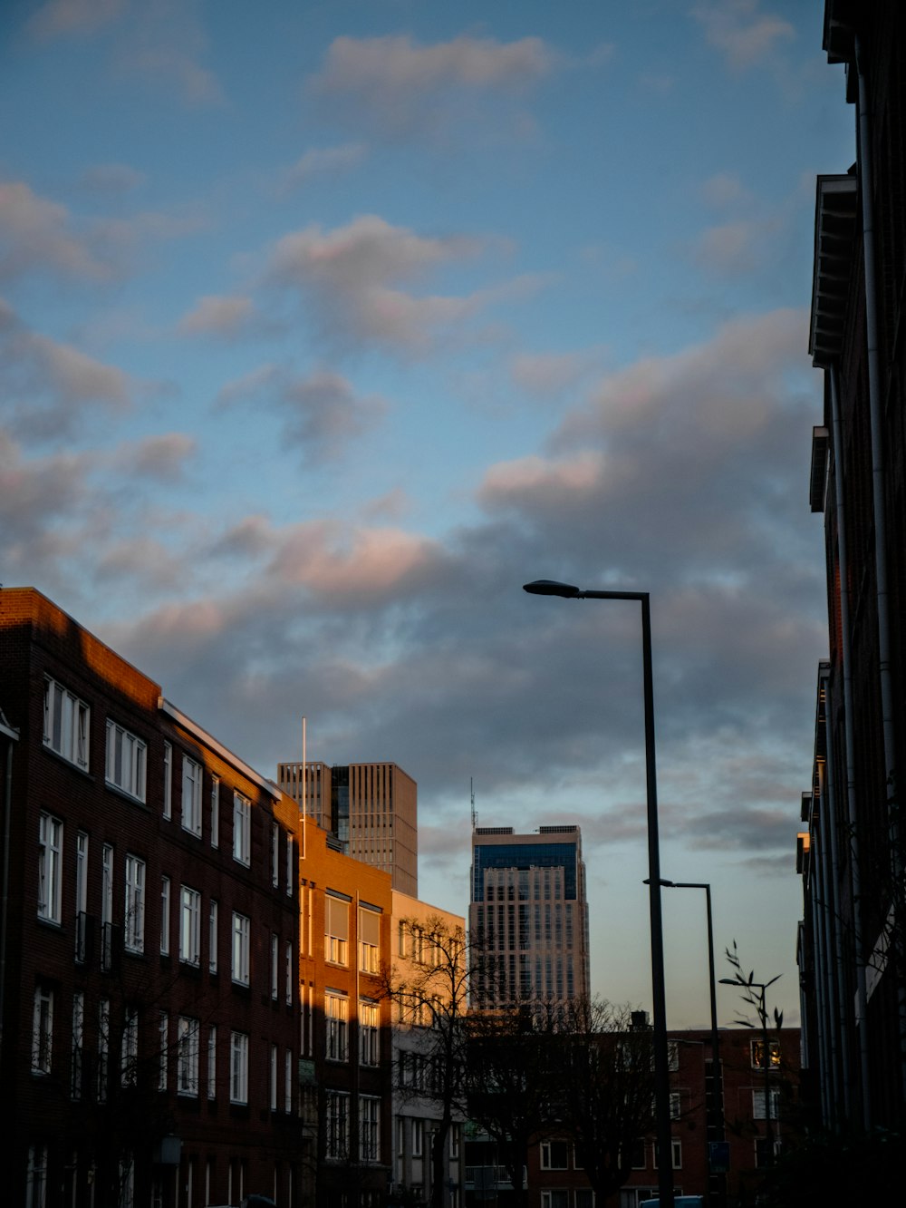 a city street with buildings and a street light