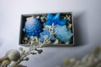 A close-up of a soap bar with seashells and ocean-themed decorations.
