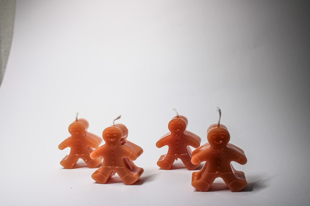 a group of small plastic figures of a man and woman