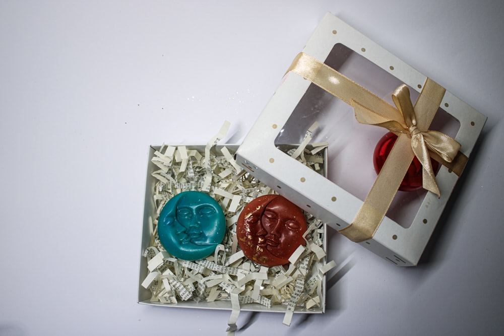 a box with a wax stamp and a wax seal in it