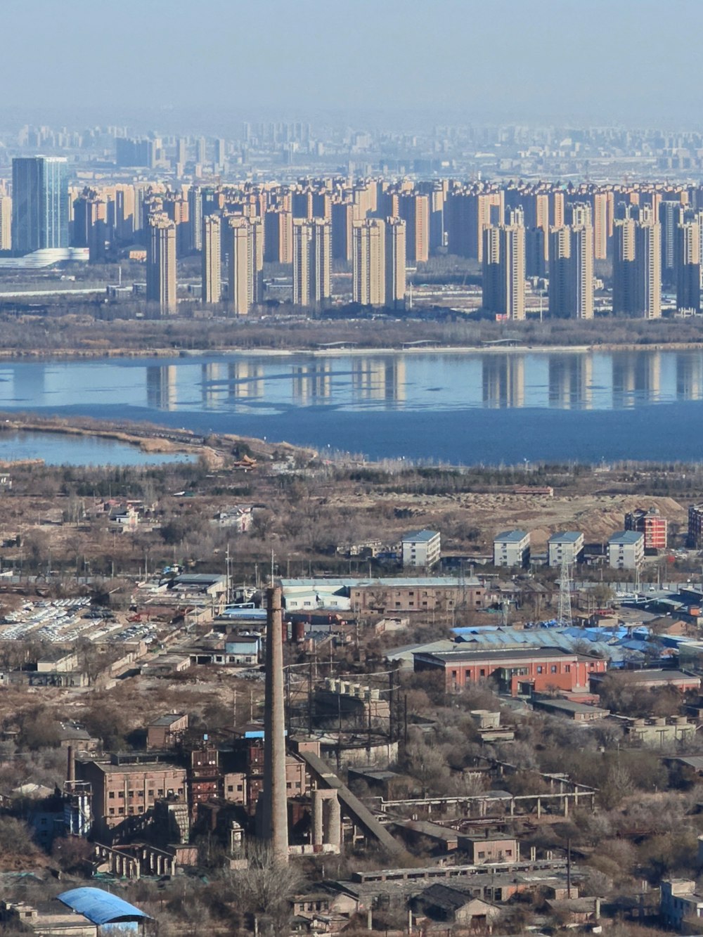 a view of a large city with a river running through it