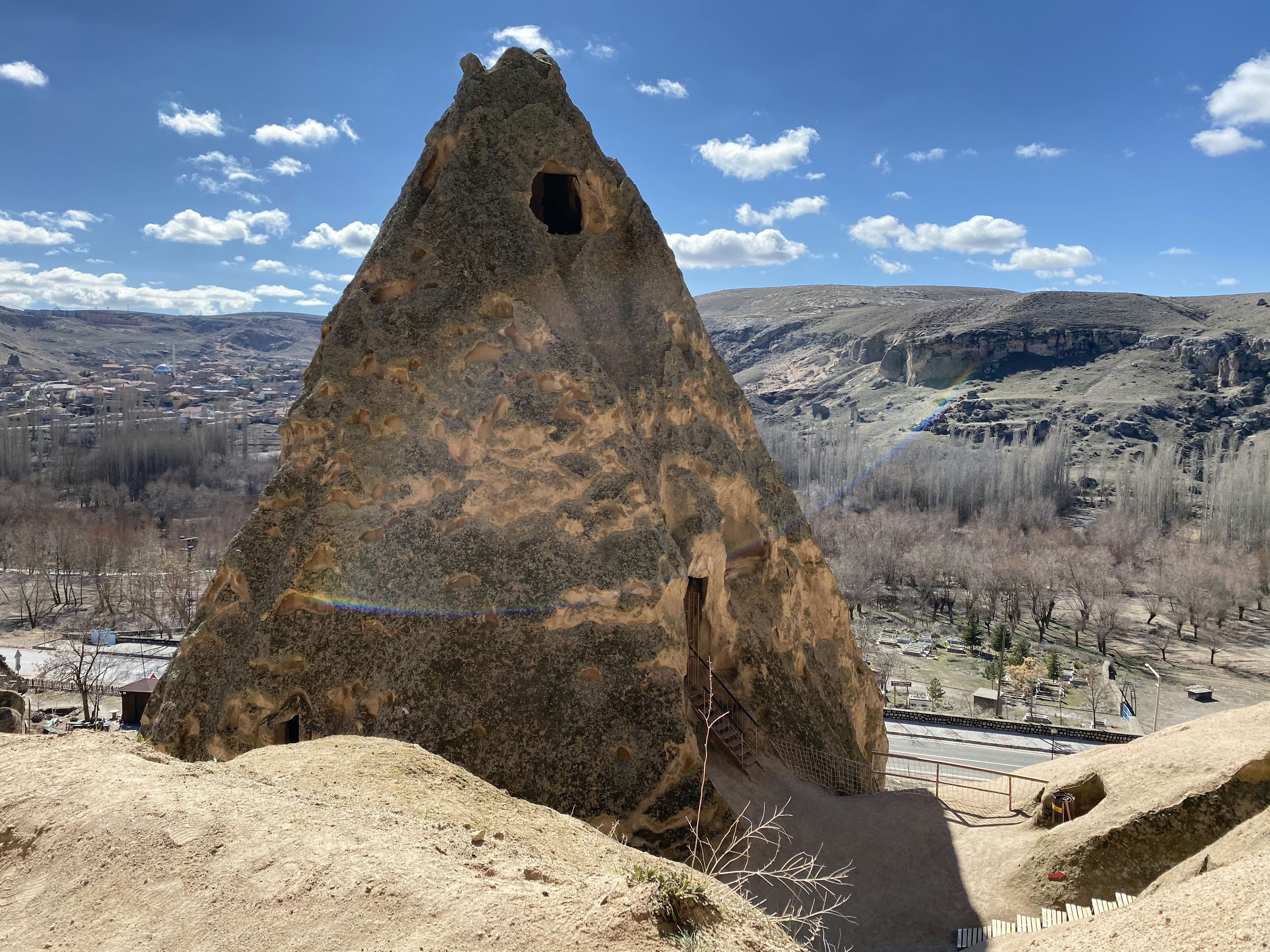 a large rock with a hole in the middle of it