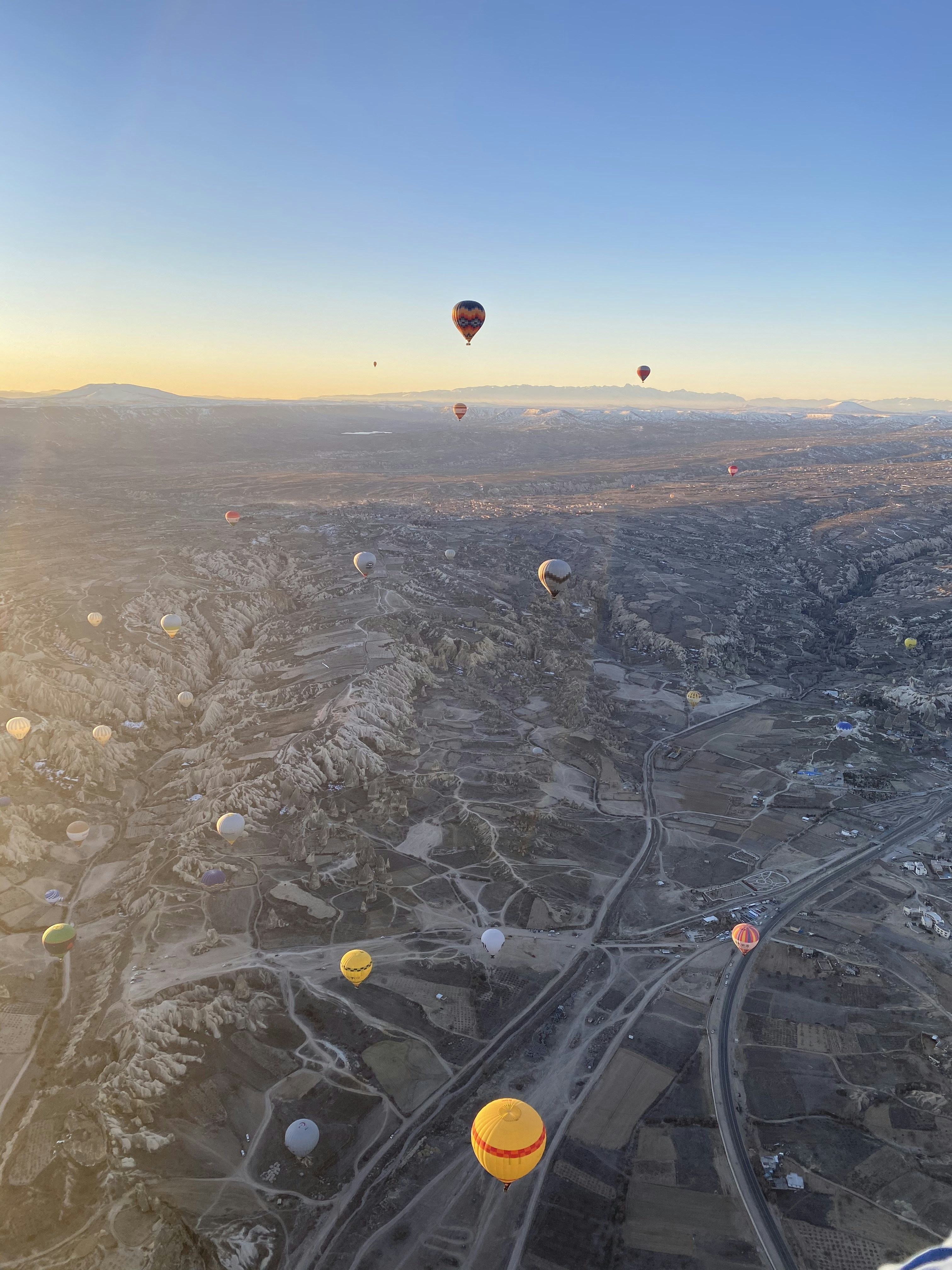 a bunch of hot air balloons flying in the sky