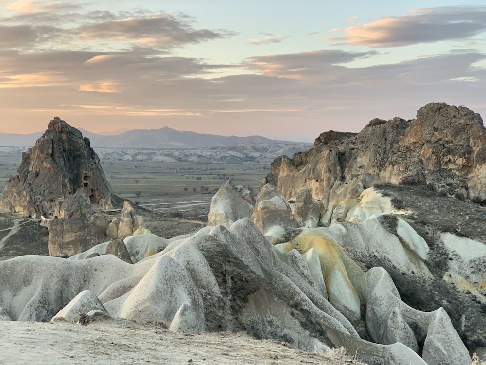 a group of rocks in the middle of a desert