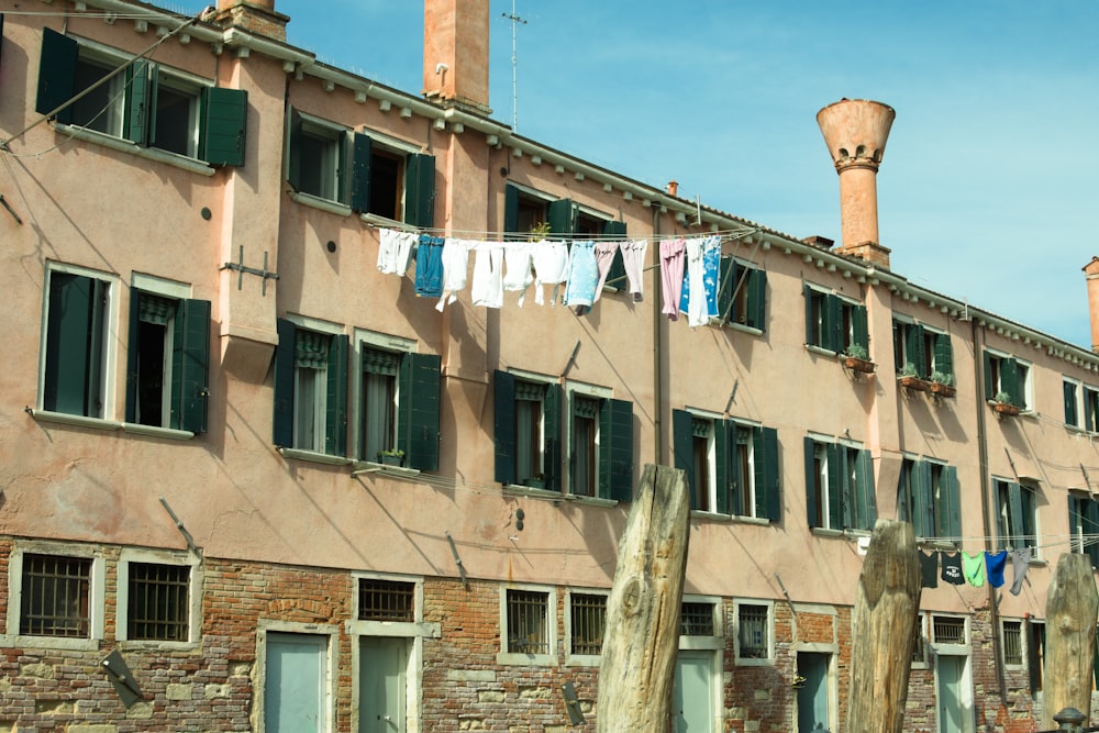 an old building with clothes hanging out to dry