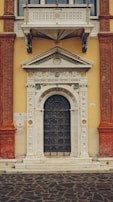 View of the entrance to il tempio di aton, showcasing elegant design and warm welcome.