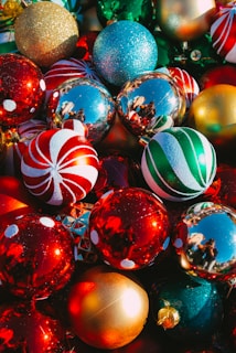 Handcrafted Christmas baubles with vibrant colors and eco-friendly sparkle displayed on rustic wooden shelves.