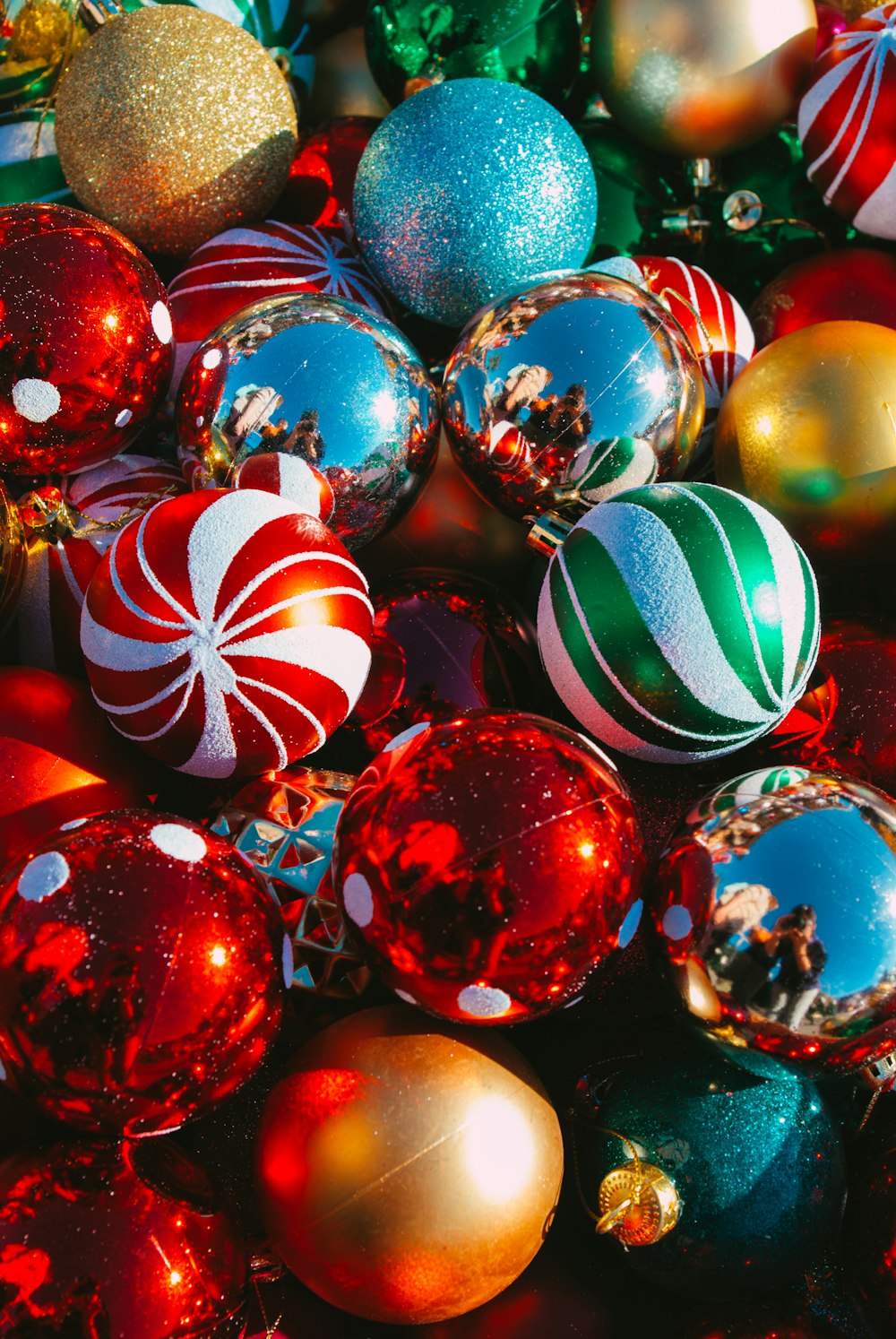 a pile of christmas ornaments sitting on top of each other