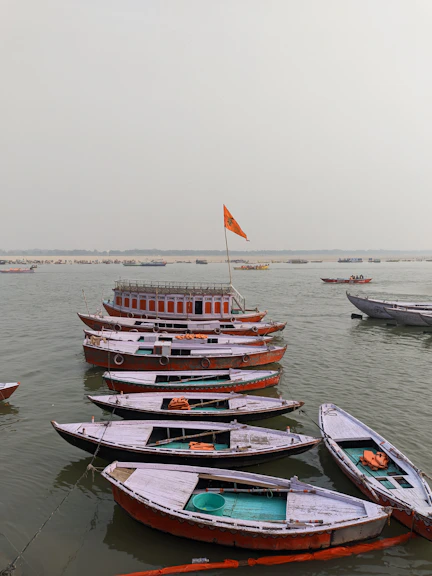 a group of boats floating on top of a body of water