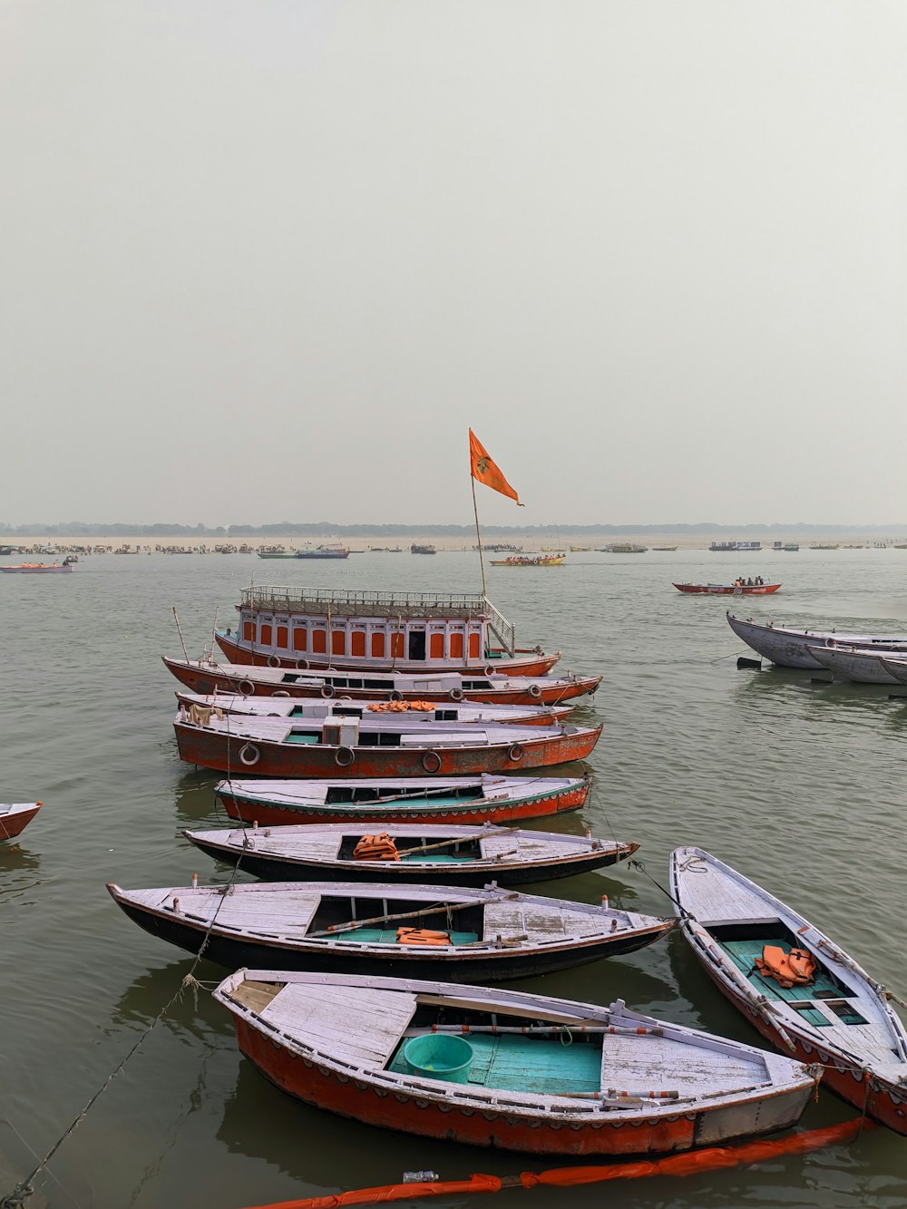 a group of boats floating on top of a body of water