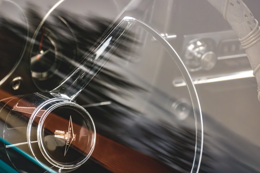 a close up of a steering wheel and dashboard of a car