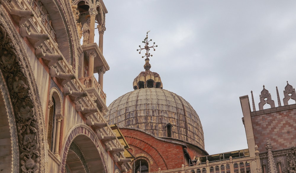 a building with a dome and a cross on top