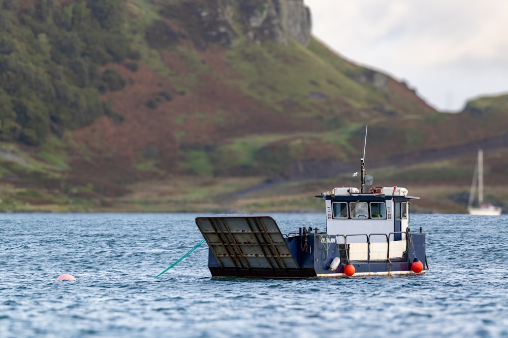 a boat floating on top of a body of water