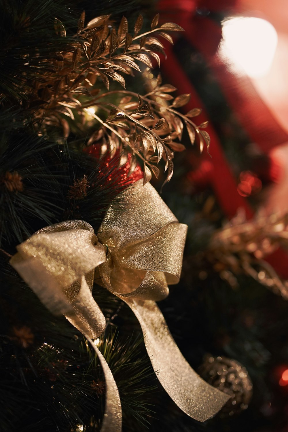 a close up of a christmas tree with a bow