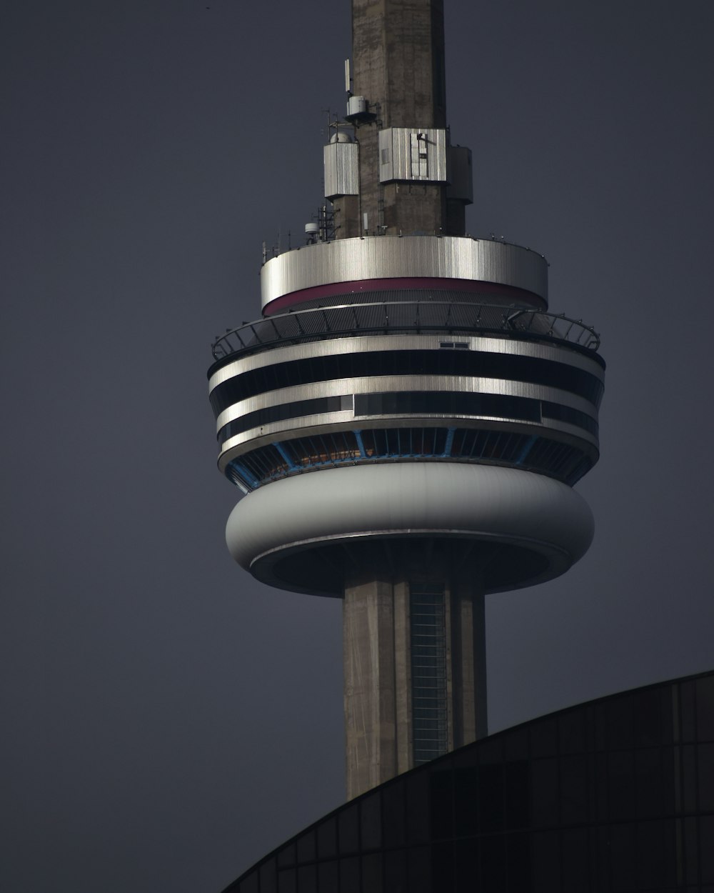 a very tall tower with a clock on it's side