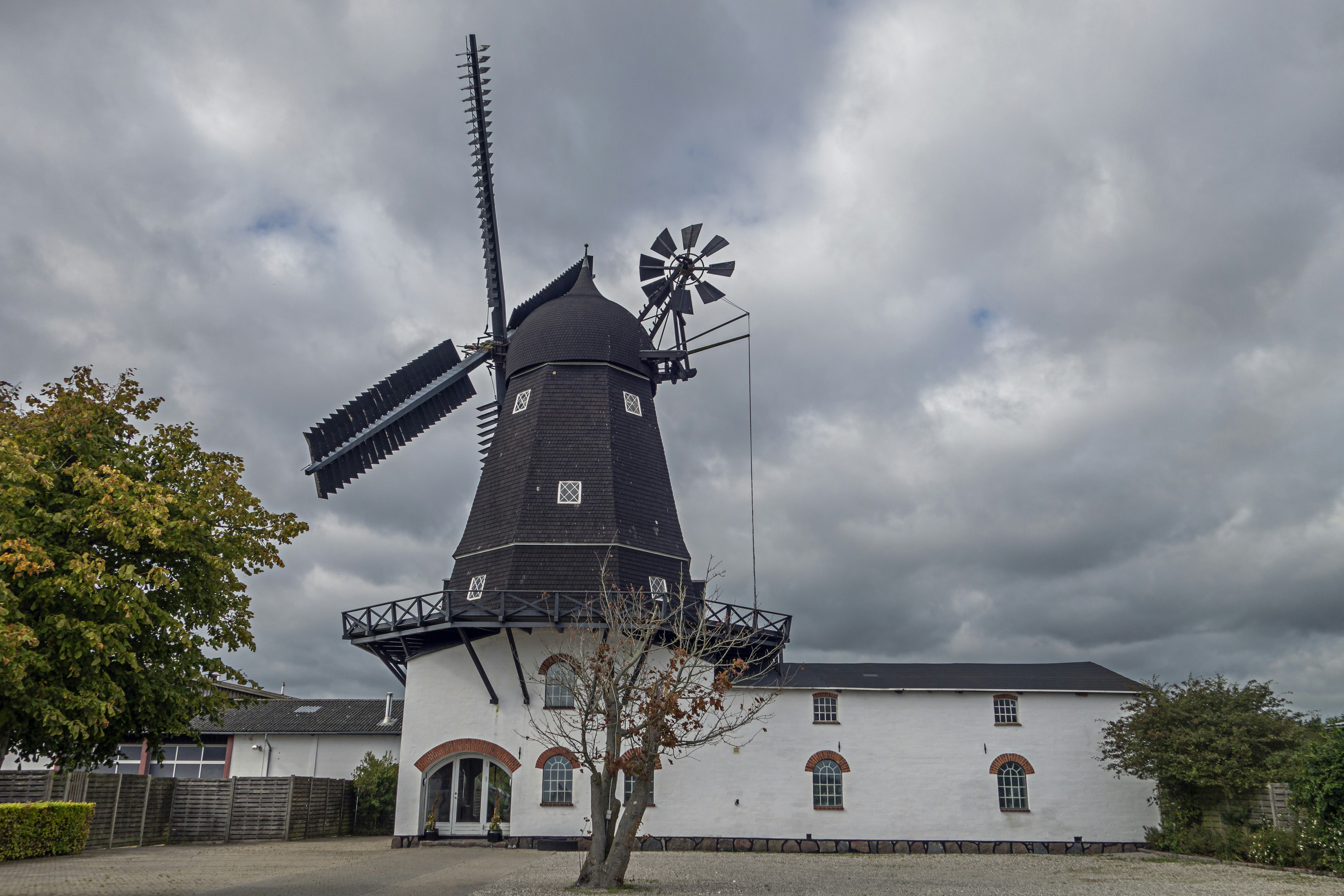 a white building with a windmill on top of it
