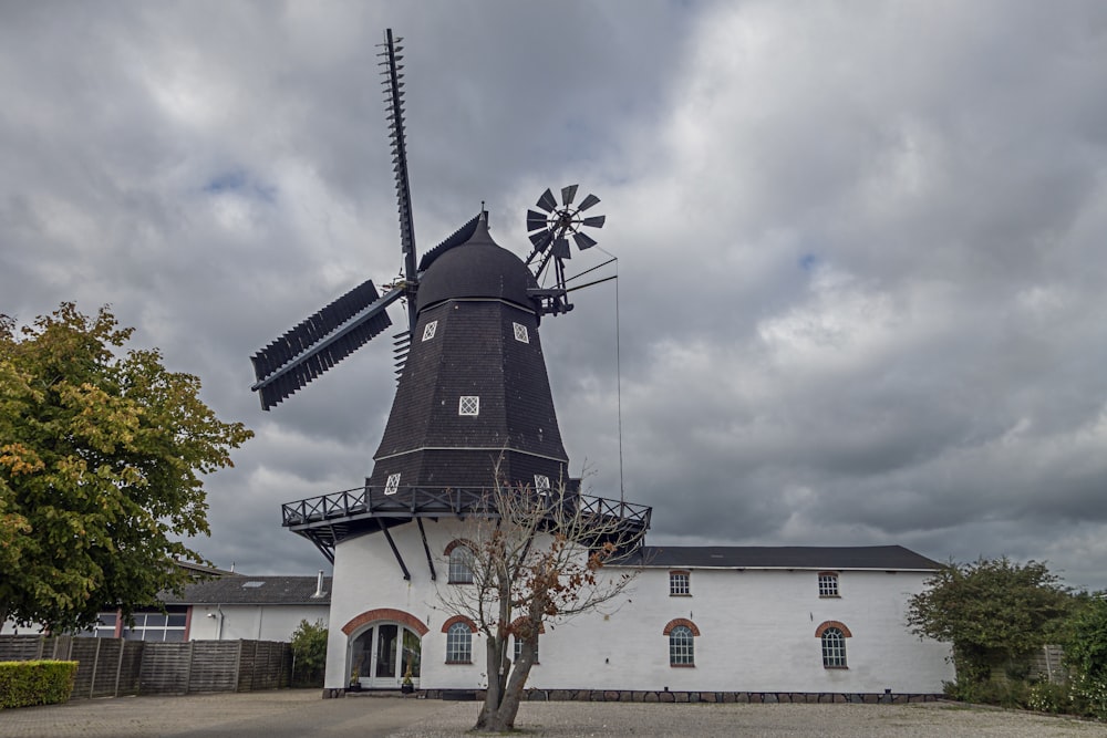 a white building with a windmill on top of it