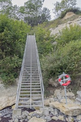 a set of stairs leading up to the top of a hill