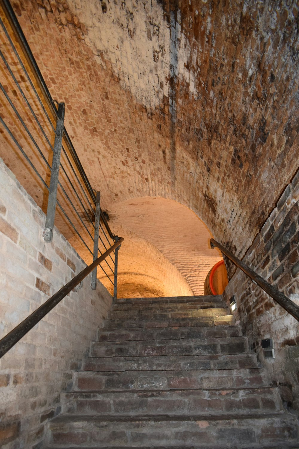 a set of stairs leading up to a tunnel